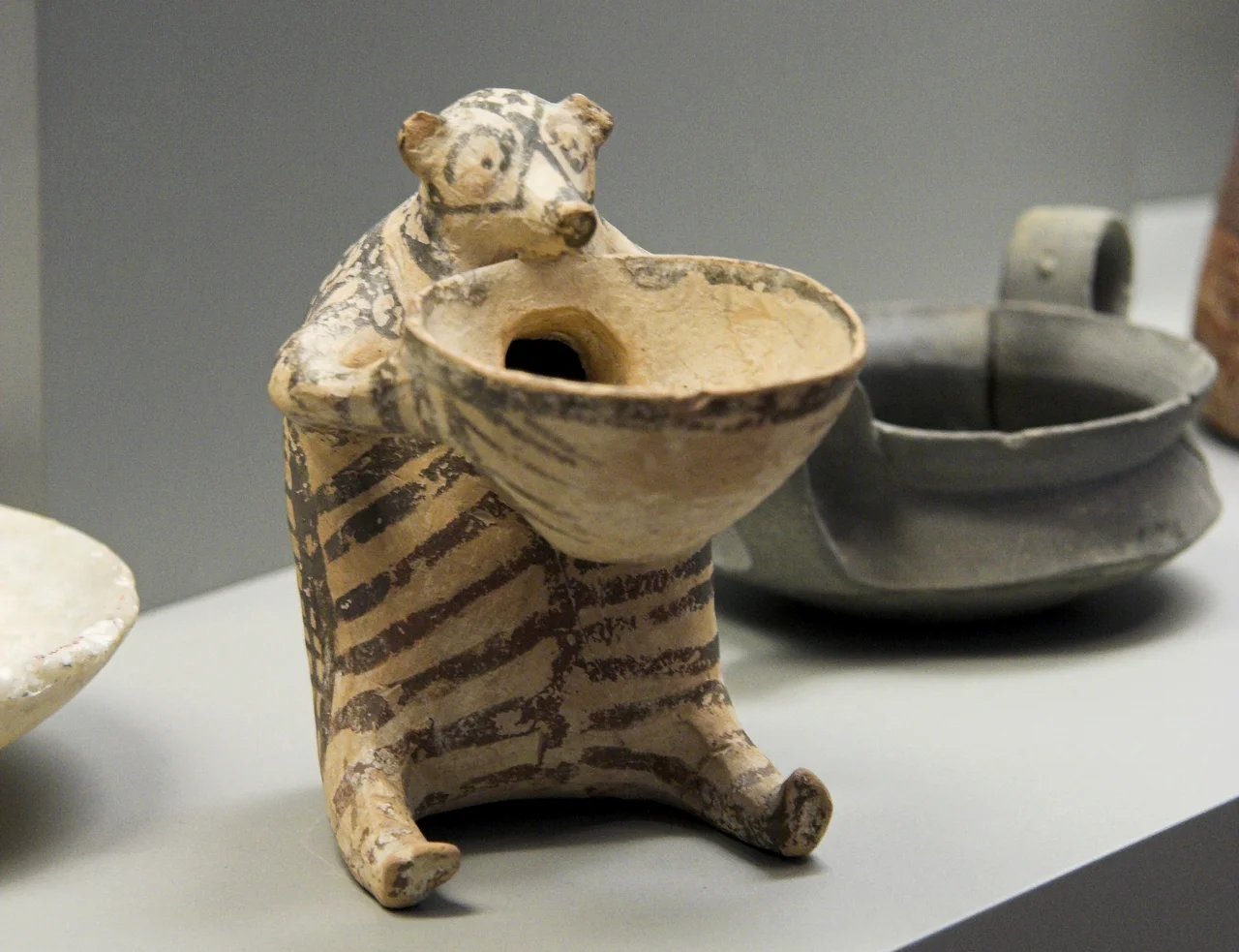 Rhyton (angeion) in the form of a bear (pig?), painted small terracotta. Syros, Chalandriani. EC II, 2300 to 2300 BC. National Archaeological Museum of Athens N6176.