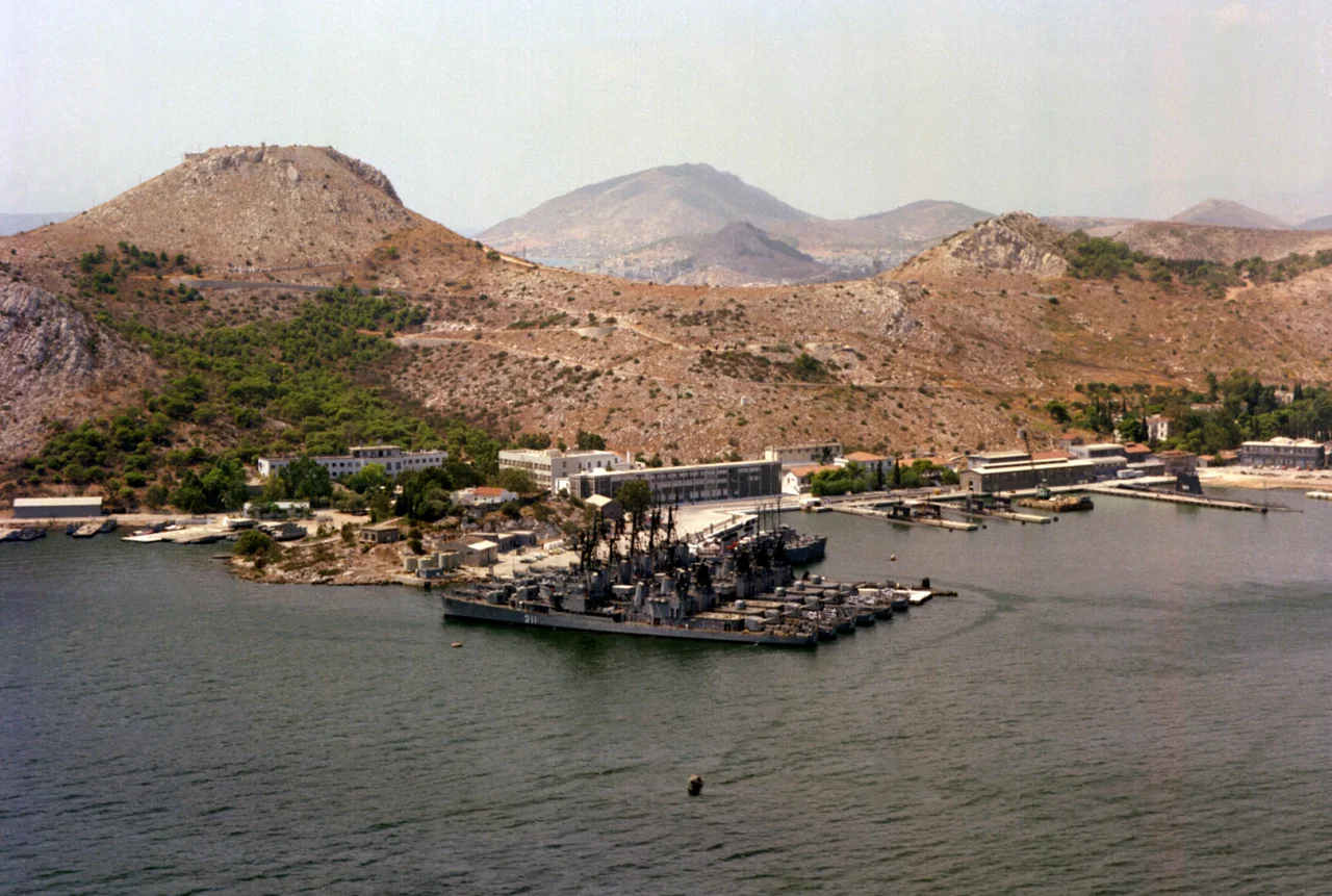 View of the Greek Salamis Naval Base in 1979. Visible are six Greek Gearing and Allen M. Sumner-class destroyers, Miaoulis (D211) (ex USS Ingraham (DD-694) is nearest to the camera. Also visible are four Type 209 submarines, a former U.S. GUPPY-class submarine, probably Katsonis, and three former U.S. Navy Bluebird-class minesweepers.