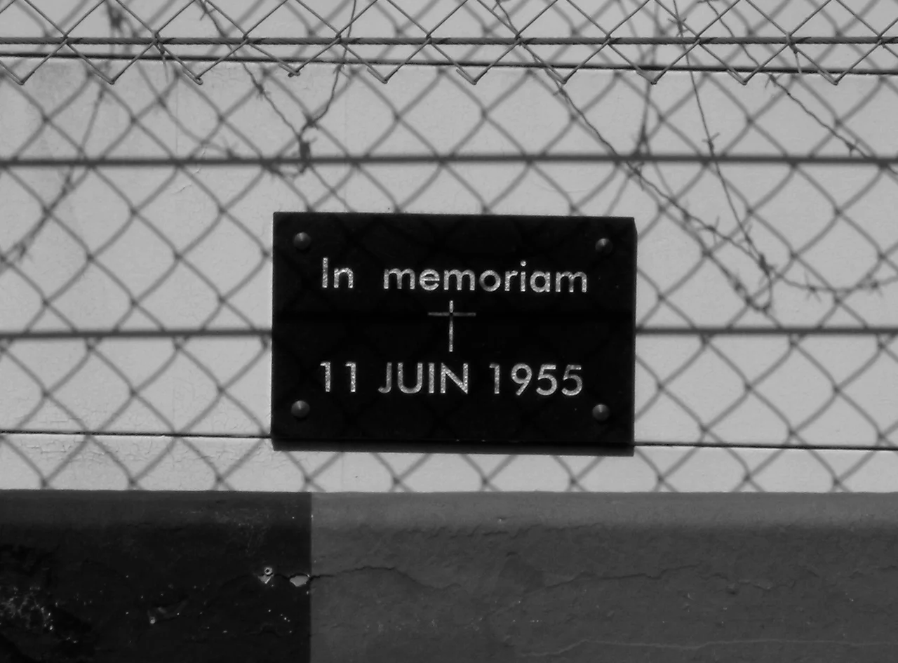 Phtotgraph of the memorial plaque at the site of the 1955 Le Mans disaster, taken by me at the 2009 Le Mans event from the pit lane on the other side of the pit straight
