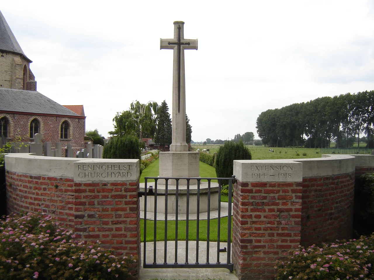 Reningelst Churchyard Extension. Commonwealth military cemetery next to the churchyard of the church of Saint Vedast in Reningelst. Churchyard: 3 burials from First World War; Extension: 56 from First World War and 3 from Second World War. Reningelst, Poperinge, West Flanders, Belgium.