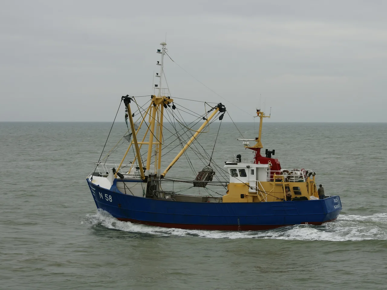 N.58 Pascin. Fishing vessel equipped with a benthic dredge, leaving the port of Nieuwpoort, Belgium.