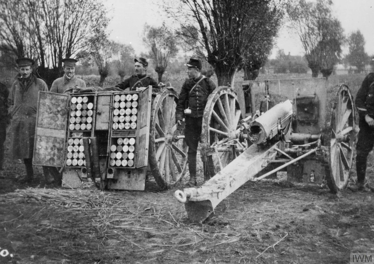 IWM caption : "Two officers (Davidson, M. O., and Churchill) of the 1st Cameronians by a 75 mm. French Field Gun and ammunition waggon at Bas Maisnil".