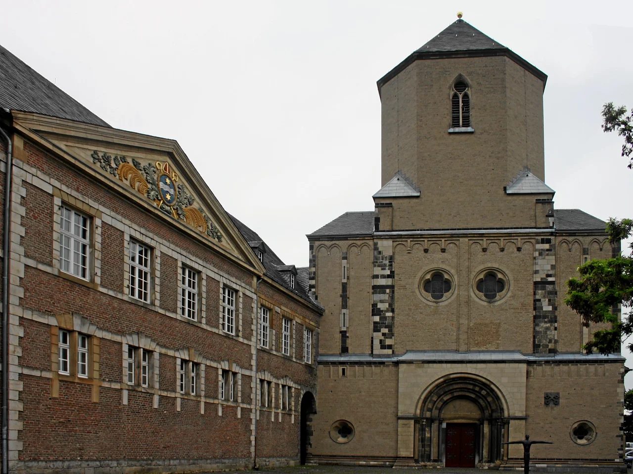 Mönchengladbach, Germany. Roman-catholic church St. Vitus, exterior view from East, and south-wing of the former abbey buildings (today: town hall).