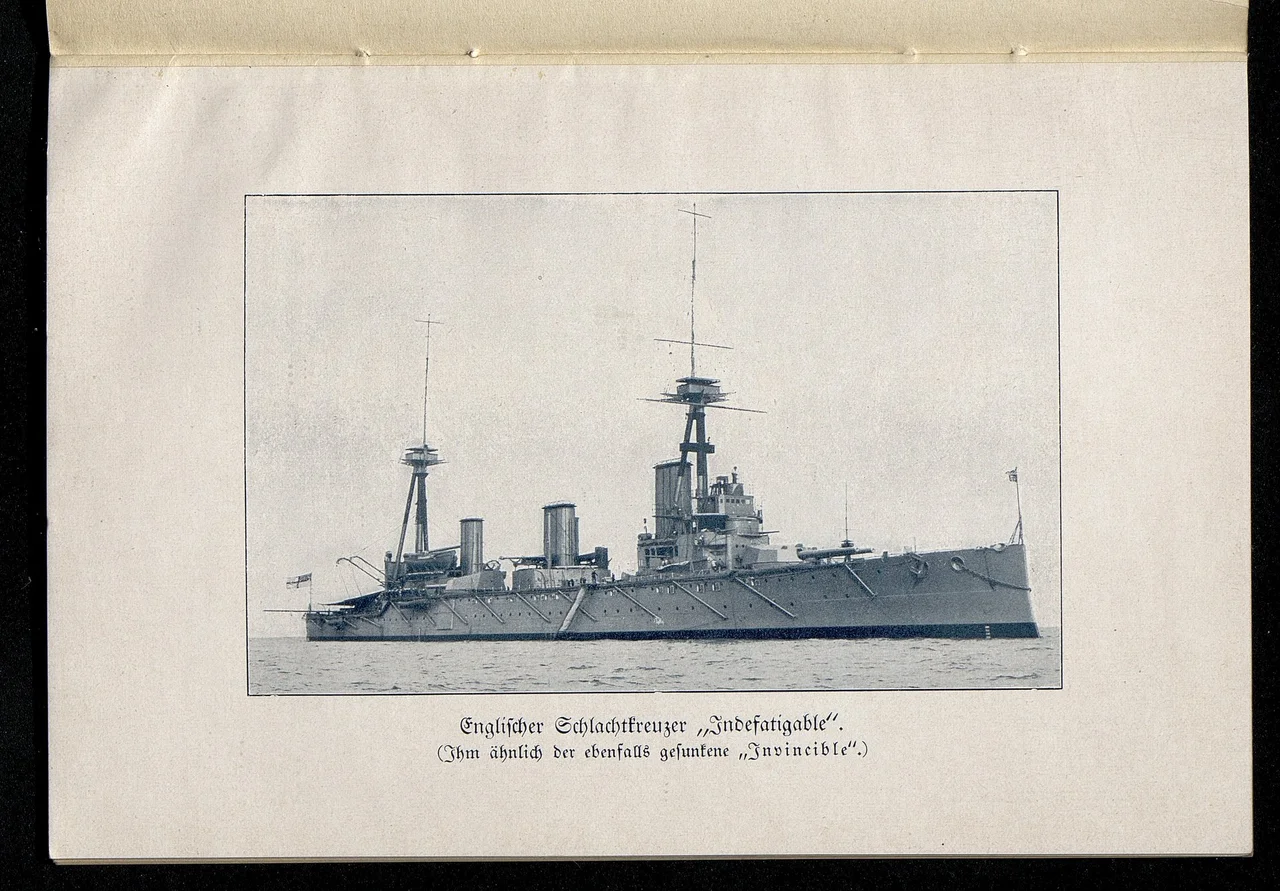 In the distance the British battlecruiser HMS Indefatigable sinking after being struck by shells from the German battlecruiser Von Der Tann first in "X" magazine and then once she had limped out of the line she was hit by another salvo on the foredeck, the resulting explosion then destroying her. All but two of Indefatigable's crew of 1,119 were killed in the blast.