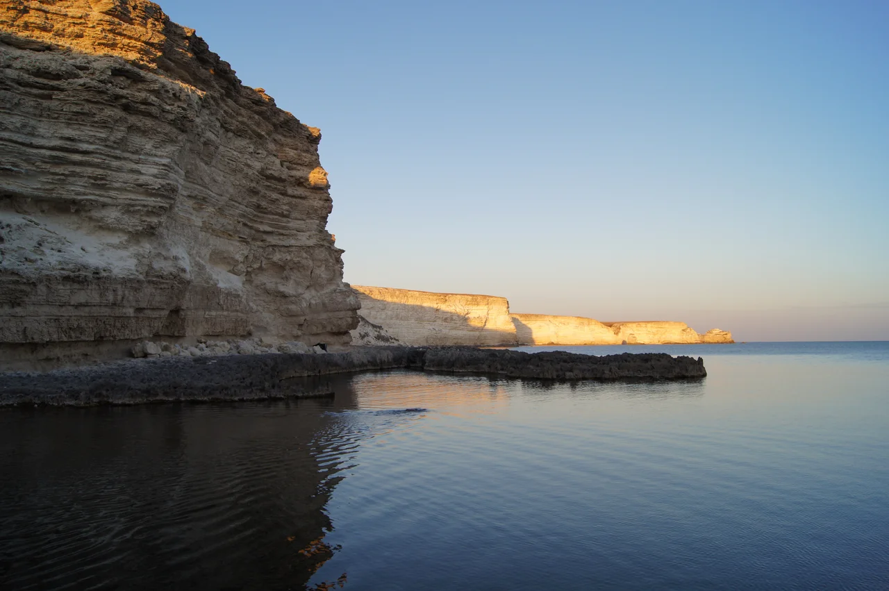 Tarkhankut is a delightful contrast of limestone rocks and crystal clear emerald sea color. You bring light in... to a dark place, walking in light, glowing walking in light, gold ring around you, the hues of you, the golden sunlight of you. Tarkhankut, Crimea.