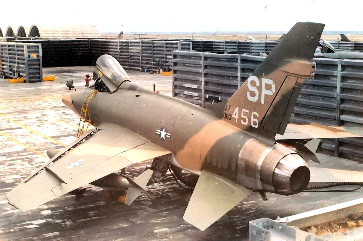This photo is actually the property of me, Sgt John Panas, Jr (retired MSgt), the crewchief of Acft 56-3456.  I crewed her from 1969 to 1970.  Named "Darlene's Dear" by my pilot, Lt Col Reagon. I climbed the revetment wall to get this angle for the picture.  It was a favorite technique used by many of the crewchiefs at the time.