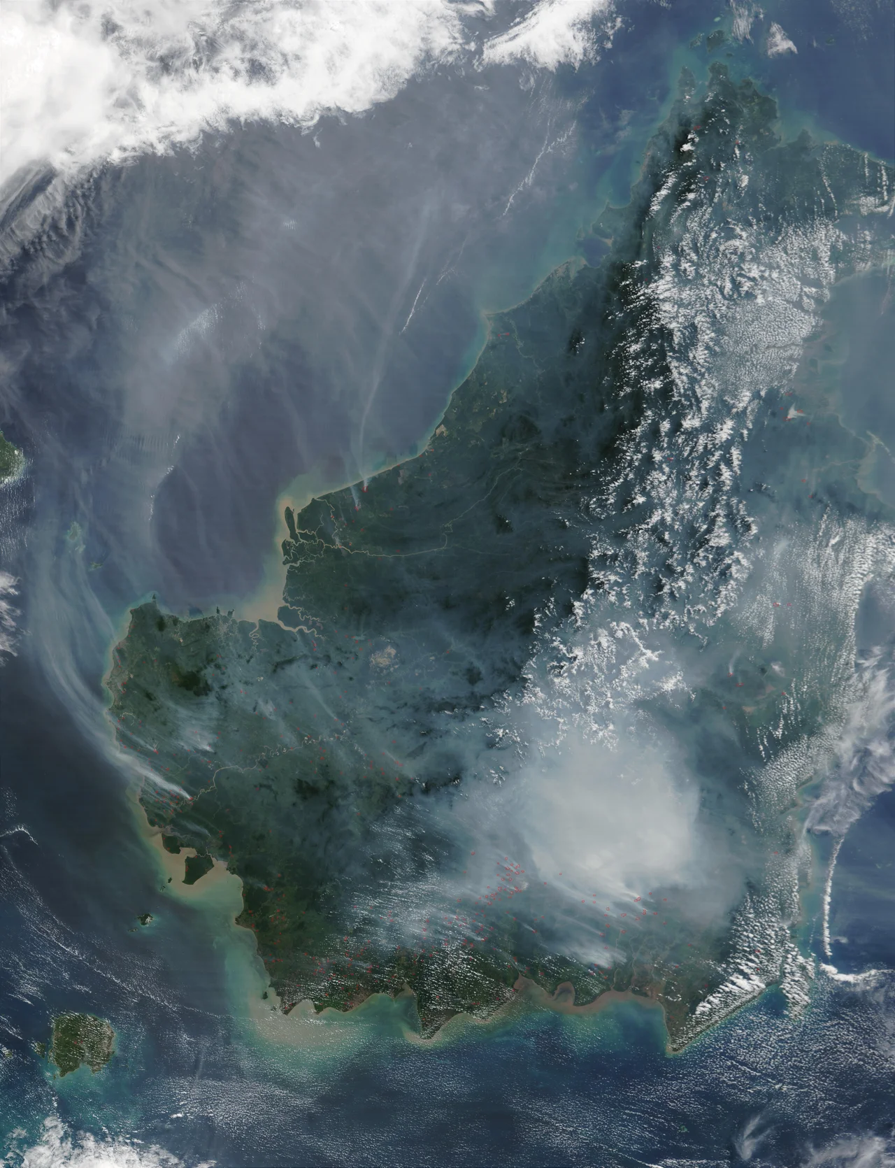 Thick smoke in Borneo resulting from slash-and-burn practices.  The red squares on the image denote fires, picked up by the Moderate Resolution Imaging Spectroradiometer (MODIS) on the Terra satellite.